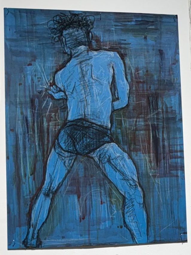 Standing figure seen from behind, drawn over a streaked blue painted ground